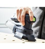 Pressing the power button on the sander