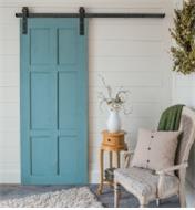 Example of door hung with Classic Face-Mount Barn-Style Door Hardware