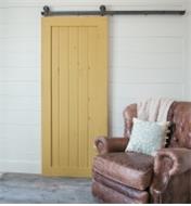 A door mounted with Classic Top-Mount Barn-Style Door Hardware