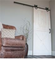 A door mounted with Horseshoe Barn-Style Door Hardware