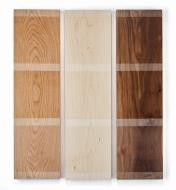 Blocks of cherry, maple and walnut wood with examples of matte, satin and satin pigmented finishes
