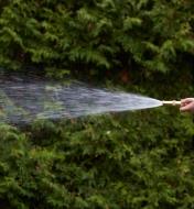 Brass Hose Nozzle spraying a narrow stream of water
