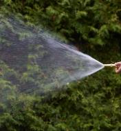 Brass Hose Nozzle spraying a wide stream of water