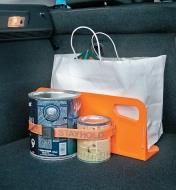 18" Cargo Organizer Bracket supporting a shopping bag and holding paint cans in place with the optional strap