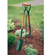 Macgregor Tool Butler supporting a shovel and fork in a garden