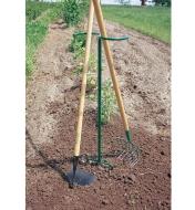 Macgregor Tool Butler supporting a hoe and rake in a garden
