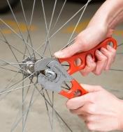 Using cone wrenches to adjust a bicycle wheel