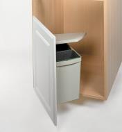 Cover of the waste container lifting as the cupboard door is opened