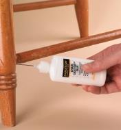 Injecting Chair Doctor glue into a chair joint