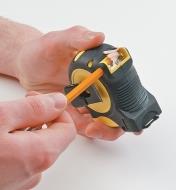 Pencil being sharpened in the built-in pencil sharpener