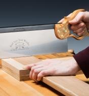 Using the 14" Sash Saw to cut through boards on a workbench