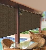 Two Coolaroo Roller Blinds installed on a pool deck