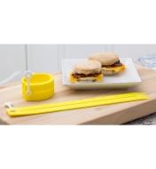 Two Adjustable Silicone Egg Rings beside two breakfast sandwiches made with eggs, bacon and cheese