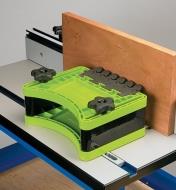 Dual featherboard in use on a router table while profiling an edge