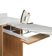 Drawer-Mount Folding Ironing Board unfolded with iron sitting on top