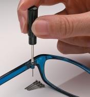 Tightening a screw in an eyeglasses frame