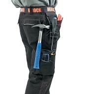 A man wearing Black Heavyweight Pants with various tools in the loops and pockets