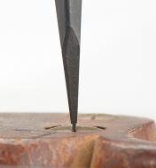 Close-up of screwdriver tip tightening a screw