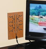 Fractal Antenna Kit mounted on a board and hooked up to a TV