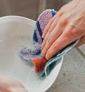 Using the Euroscrubby Scouring Pad to wash a bowl