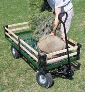 Loading a tree into the wagon with side racks