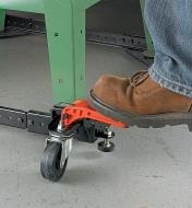 Pressing on the lever with the tip of a shoe to engage mobile base wheels