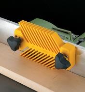 Magnetic featherboard attached to the fence of a jointer