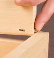 Installing a hinge pin in a box lid
