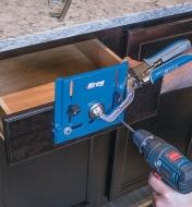 Kreg Hardware Jig used with clamp to drill hole for drawer pull