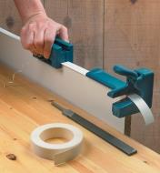 Edge Trimmer and laminate end trimmer being used on a door edge