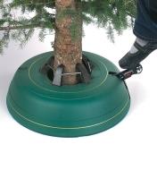 Pumping the foot pedal to secure the tree in the stand