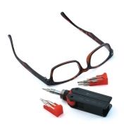 Micro-Tip Ratcheting Pocket Screwdriver lying next to a pair of glasses