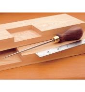 Lee Valley Scratch Awl and ruler sitting on boards with mortises cut in