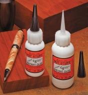 Hot Stuff glues displayed with wood blocks and a turned pen
