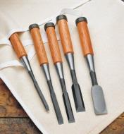 Set of 5 Bevel-Edge Chisels lying on the included canvas roll