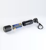 9-LED Flashlight with battery compartment removed to show three AAA batteries