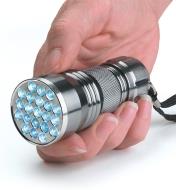 Holding a 21-LED Flashlight in a hand