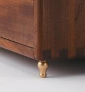 Brass Vase Box Foot installed on a cabinet