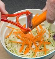 Using the Julienne Peeler to cut strips off a carrot