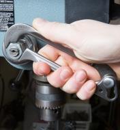 Tightening a bolt on a drill press