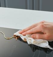 Using a Reusable Tear-Off Towel to wipe up a spaghetti spill