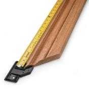 Using a measuring tape and miter hook to measure from the outside corner of molding
