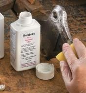 Wiping Rust Remover Gel on machinery