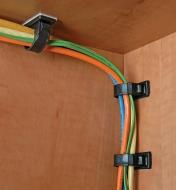Round Releasable Cable Clamps used to attach cables to the inside of a cabinet