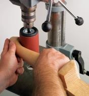 Using a Medium Pneumatic Drum on a drill press to sand a chair leg