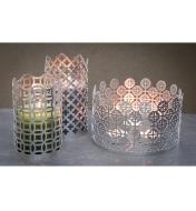 Patterned Aluminum Panels formed into candle holders