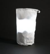 Nite Ize Radiant Lantern illuminated inside carrying bag used as a light diffuser
