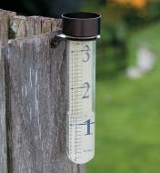 Rain gauged mounted on a fence