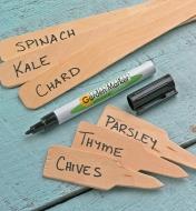 0.8mm Permanent Marker on a table between several wooden markers with plant names written on them