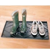 A pair of rubber boots and a pair of runners on the Rubber Boot Tray